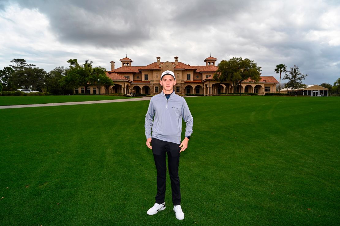 Mykhailo 'Misha' Golod stands for a photo in front of the clubhouse at TPC Sawgrass during the final round of the Players Championship.