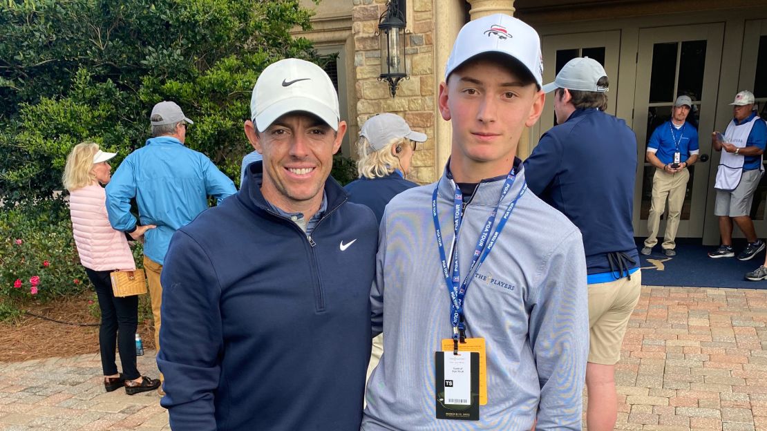 Golod poses with Rory McIroy during the Players Championship.
