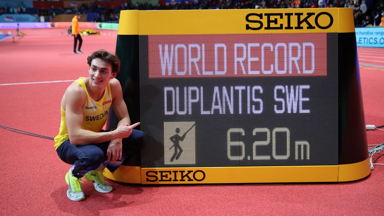 Gold medalist Mondo Duplantis celebrates after setting a new world record of 6.20m during the men's pole vault.