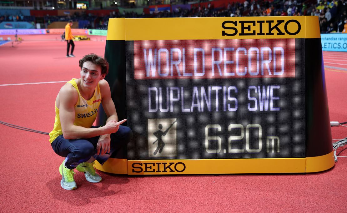 Gold medalist Mondo Duplantis celebrates after setting a new world record of 6.20m during the men's pole vault.