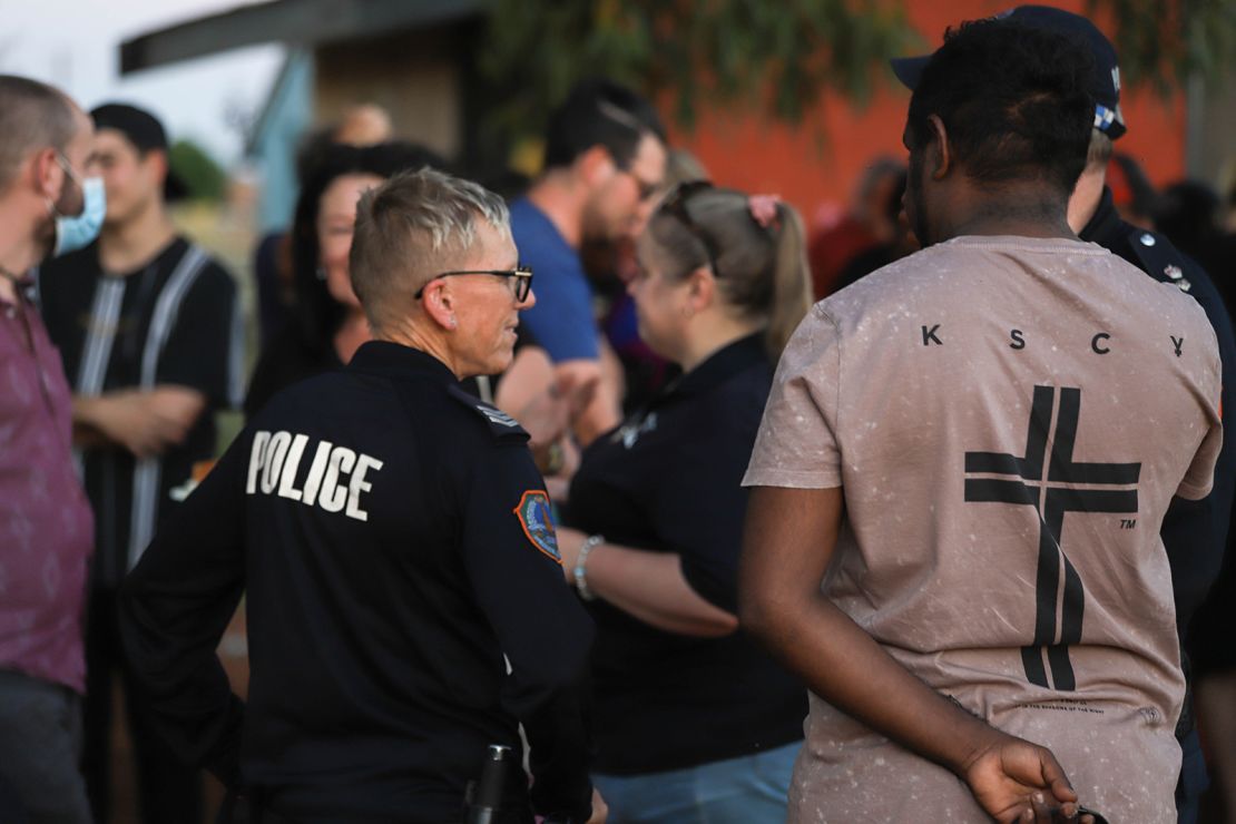 Local police officers attend a community barbecue on March 11, after Rolfe was acquitted.