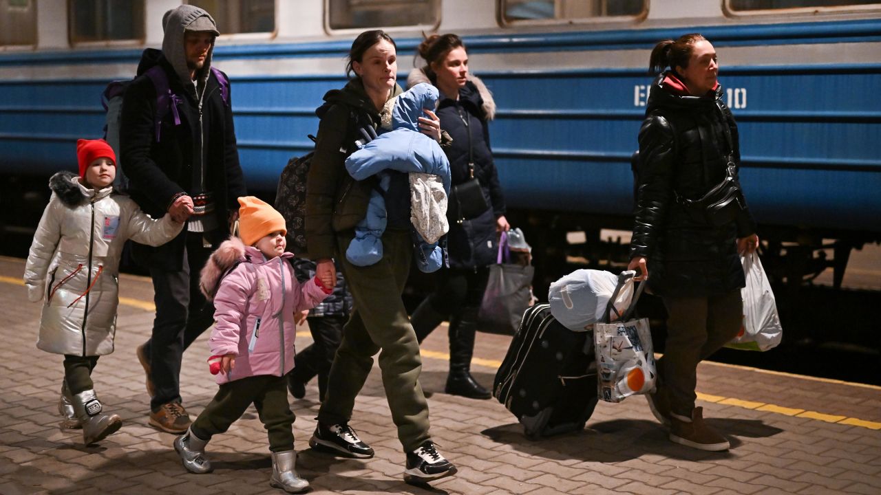 People arrive at Przemysl train station in Poland from Ukraine on Sunday.