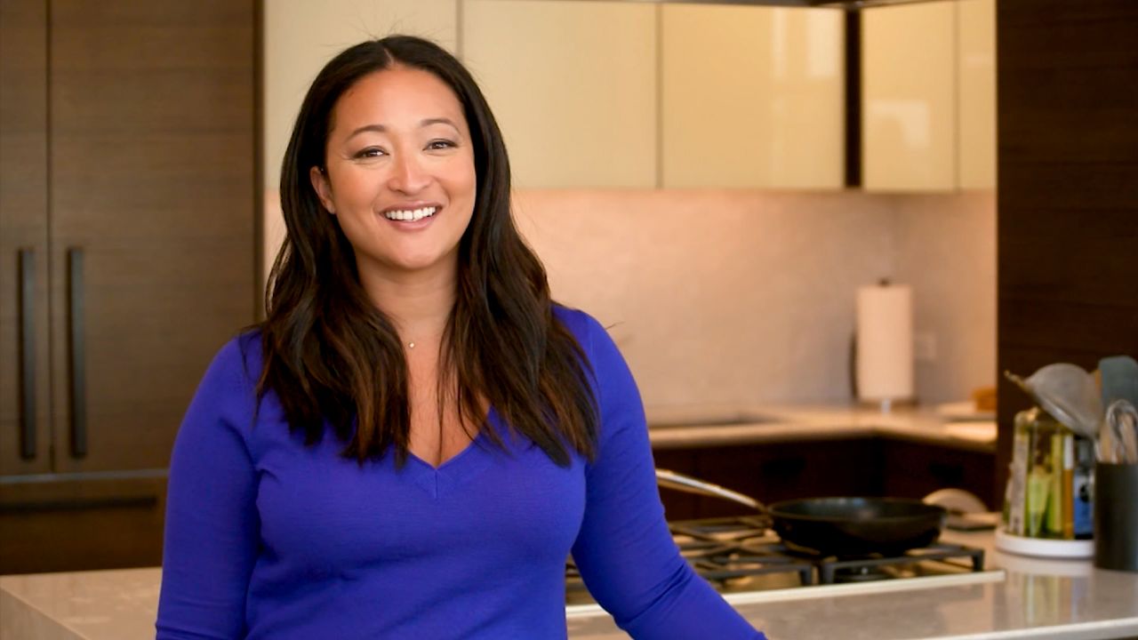 Partake Foods Founder and CEO Denise Woodard poses in her home kitchen in New York City February 11, 2022.