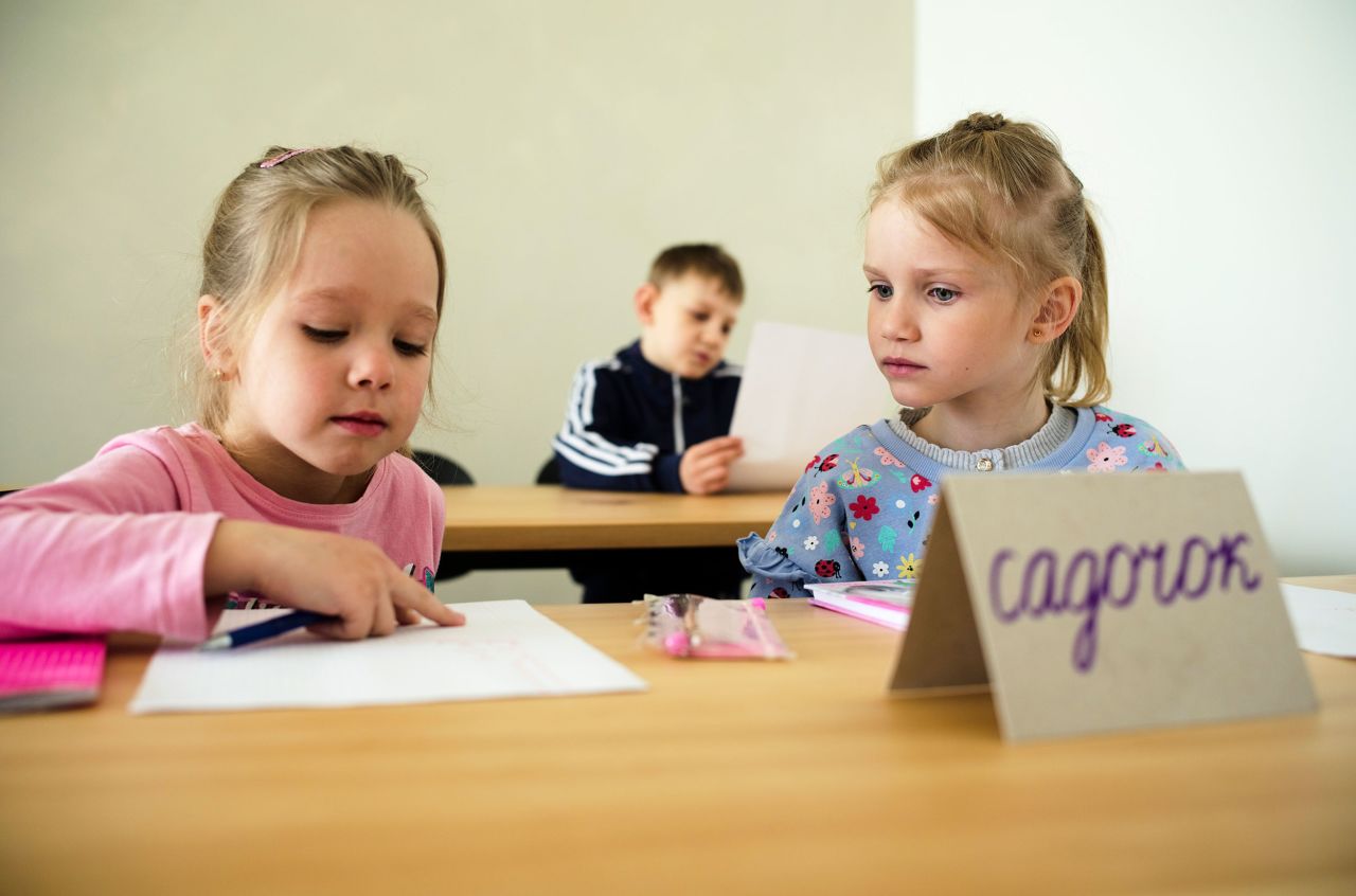 Two children attend a class for Ukrainian refugees in Berlin on March 21. Forty refugee children started their first day of elementary school. The private classes were put together by two Berlin volunteers who managed to raise funds and get free classrooms.