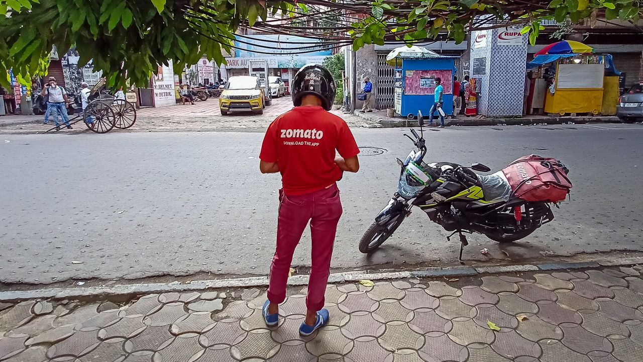 A Zomato food delivery partner is seen on a road in Kolkata, India, on July 14, 2021.