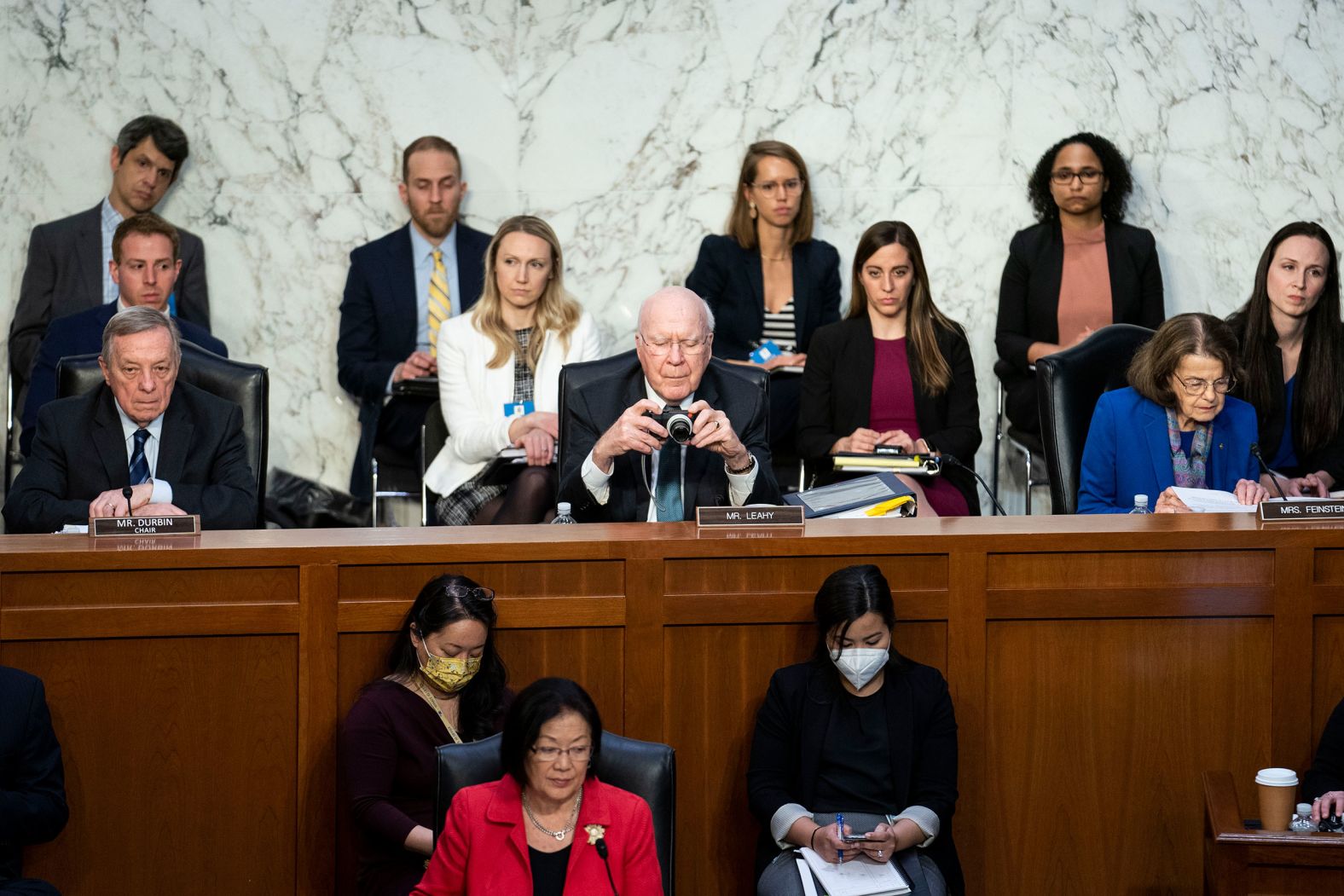 US Sen. Patrick Leahy takes a photo from his seat on March 21.