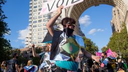 NEW YORK, NEW YORK - OCTOBER 3: Wide Awakes, a collective of of progressive artists, musicians and dancers, march through Manhattan and stop for a dance party while urging people to vote, on October 3, 2020 in Washington Square Park in New York City. (Photo by Andrew Lichtenstein/Corbis via Getty Images)