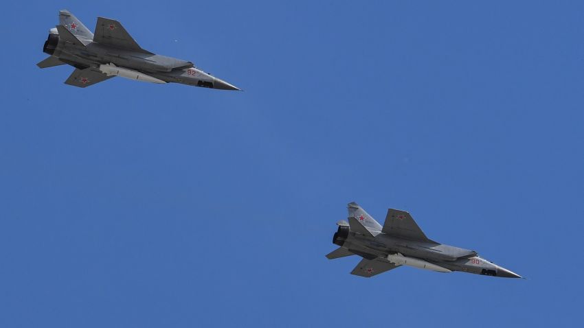 A Russian MiG-31 supersonic interceptor carrying hypersonic Kinzhal (Dagger) missiles flies over Red Square during the Victory Day military parade in Moscow on May 9, 2018.  - Russia commemorates the 73rd anniversary of the Soviet Union's victory over Nazi Germany in World War II. (Photo by Yuri KADOBNOV/AFP) (Photo credit should read YURI KADOBNOV/AFP via Getty Images)