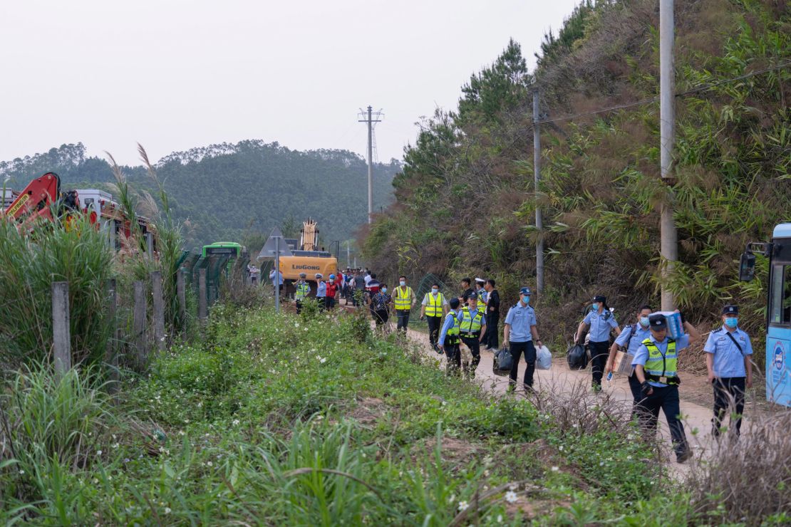 Rescuers at the crash site on March 21.