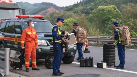 Rescuers head to the site of a plane crash on March 21 in China's Tengxian County.