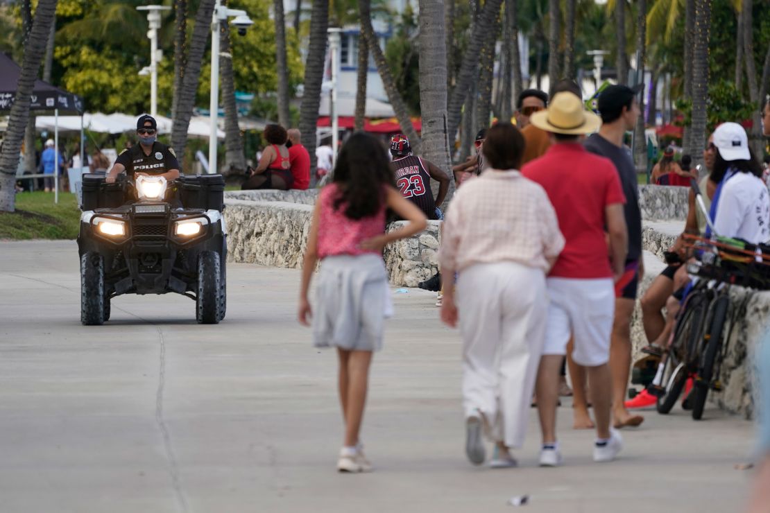 A police officer on an ATV patrols in Miami Beach's famed South Beach, Monday.