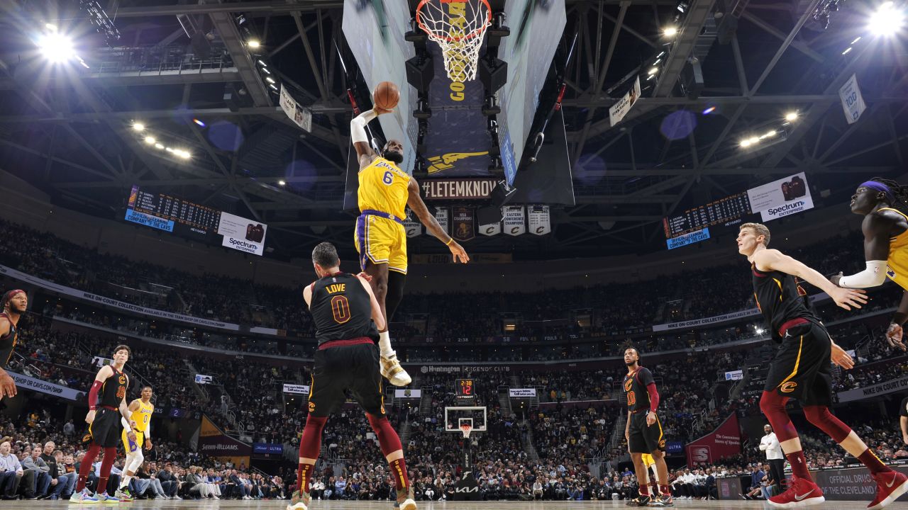 LeBron James posterizes Kevin Love in the Lakers' solid victory over the Cavs.