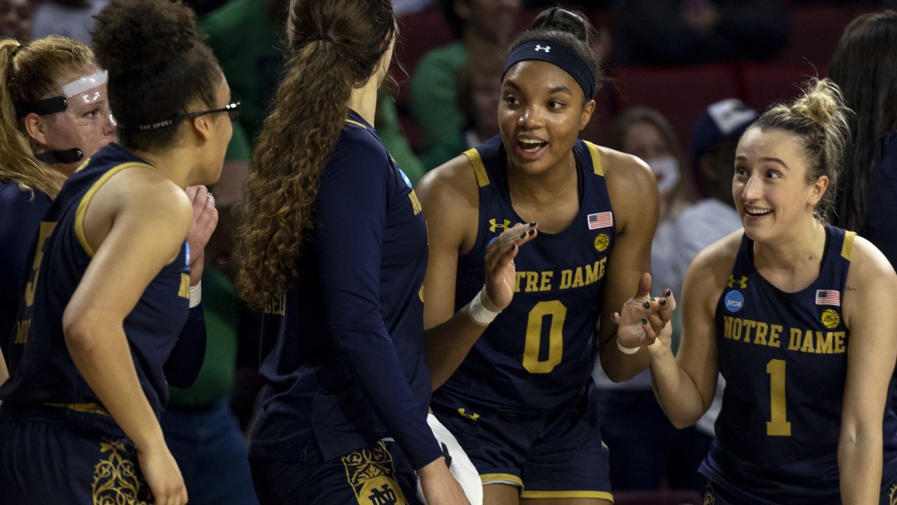 Notre Dame celebrate on the sideline against Oklahoma in the NCAA women's college basketball tournament.