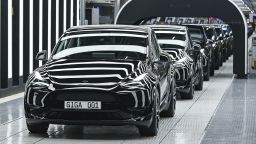 Model Y electric vehicles stand on a conveyor belt at the opening of the Tesla factory in Berlin Brandenburg in Gruenheide, Germany, Tuesday, March 22, 2022. The first European factory in Gruenheide, designed for 500,000 vehicles per year, is an important pillar of Tesla's future strategy.