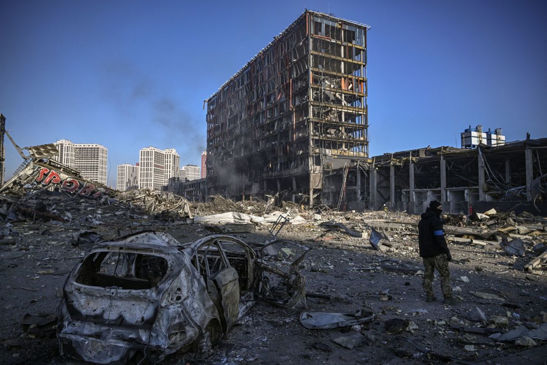 A Ukranian serviceman walks among debris outside the destroyed Retroville shopping mall in in the capital of Kyiv on March 21.