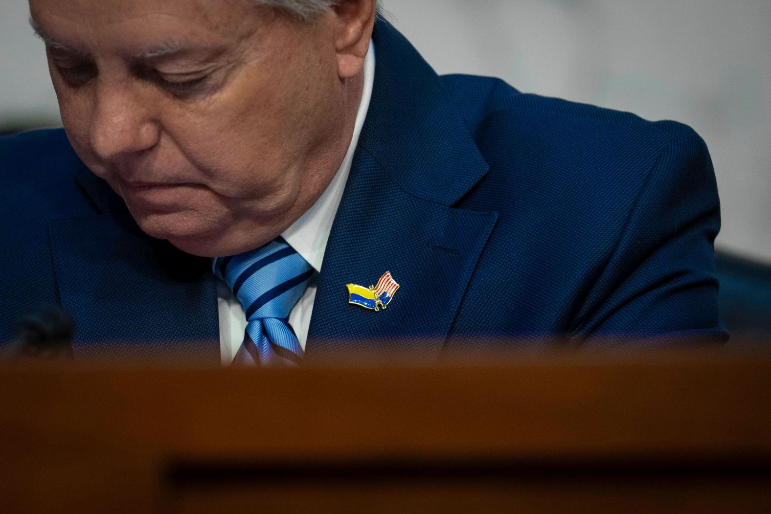 Graham wears a pin showing the American and Ukrainian flags on March 22.