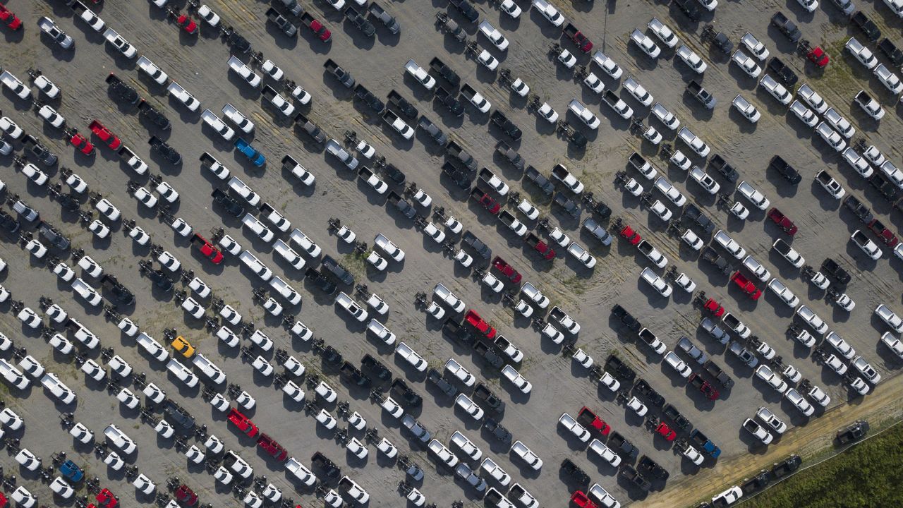 New Ford F-Series pickup trucks are stored in a lot during a semiconductor shortage at Kentucky Speedway in Sparta, Kentucky, US, on Friday, July 16, 2021.