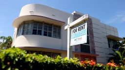 A rent sign hangs outside of a building on September 29, 2021 in Miami.