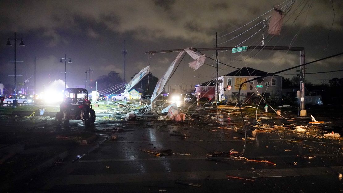 A debris-lined street is seen in the Lower Ninth Ward, Tuesday, March 22, 2022, in New Orleans, after strong storms moved through the area.
