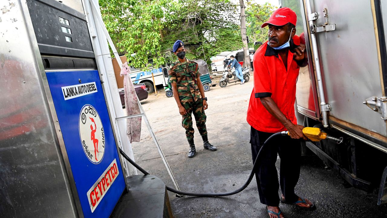 A soldier guards a fuel station in Colombo on March 22, 2022.
