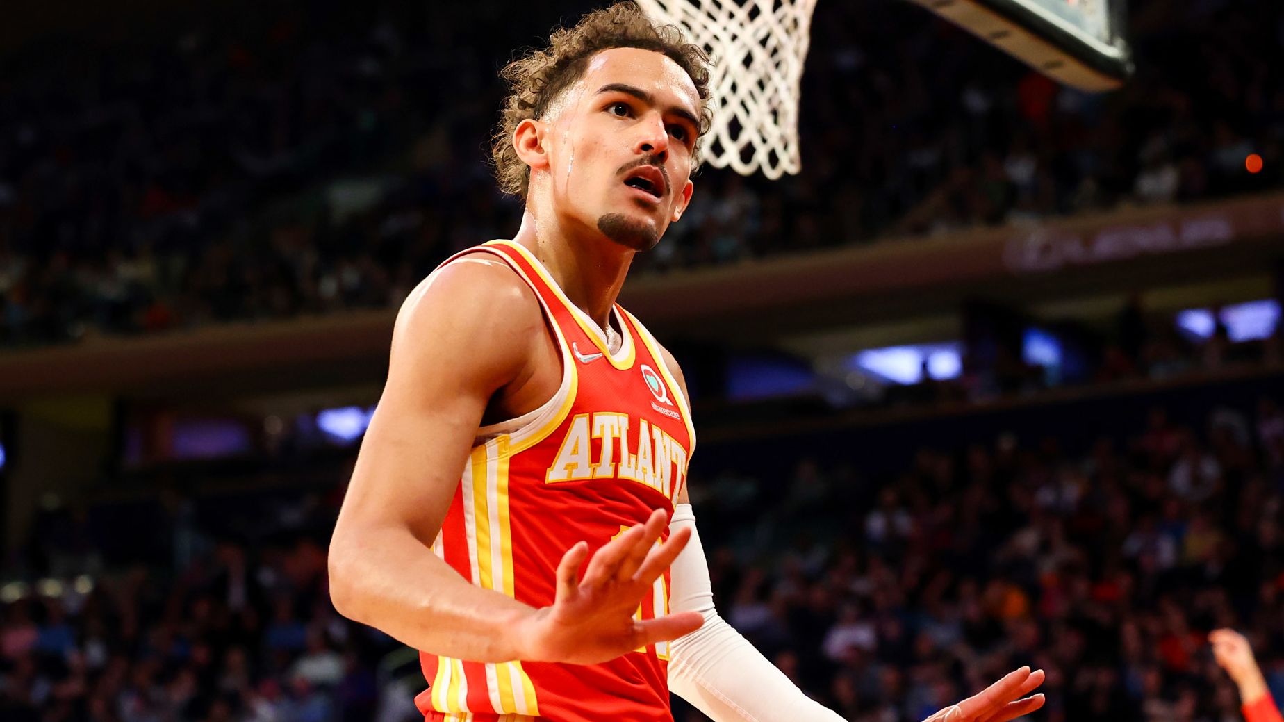 Trae Young motions to the crowd during the first half of the game against the New York Knicks.