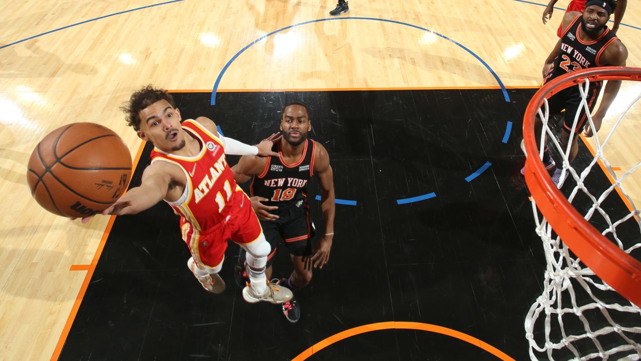 Young drives to the basket against the Knicks.