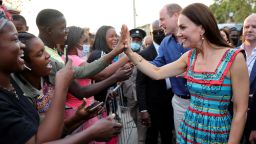KINGSTON, JAMAICA -- MARCH 22: Prince William, Duke of Cambridge and Catherine, Duchess of Cambridge shake hands with people during a visit to Trench Town, the birthplace of reggae music, on day four of the Platinum Jubilee Royal Tour of the Caribbean on March 22, 2022 in Kingston, Jamaica. The Duke and Duchess of Cambridge are visiting Belize, Jamaica, and The Bahamas on their week-long tour. (Photo by Chris Jackson-Pool/Getty Images)