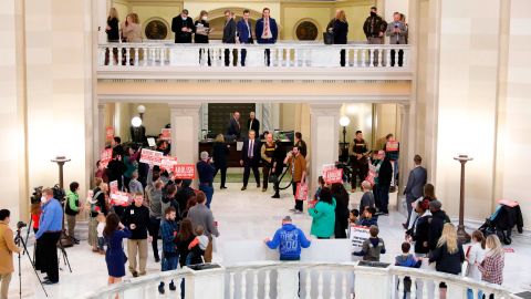 A group of Abolish Abortion protesters stand outside the House of Representatives chamber where Oklahoma Gov. Kevin Stitt delivers his State of the State address in Oklahoma City on Monday, Feb. 7, 2022.