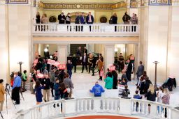 A group of Abolish Abortion protesters stand outside the House of Representatives chamber where Oklahoma Gov. Kevin Stitt delivers his State of the State address in Oklahoma City on Monday, Feb. 7, 2022.