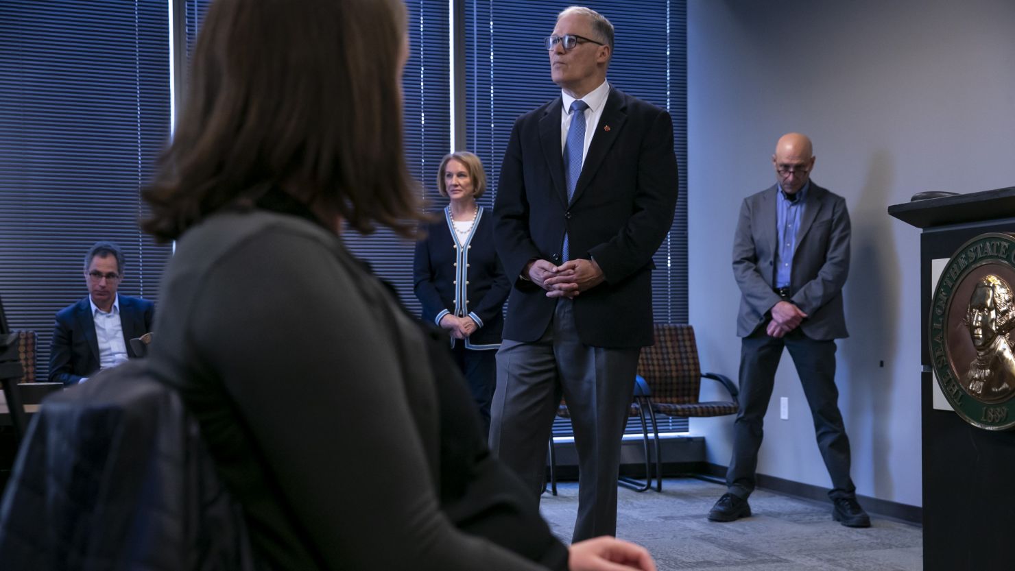 Washington Gov. Jay Inslee listens to question from reporters at a press conference about the coronavirus outbreak March 16, 2020 in Seattle.