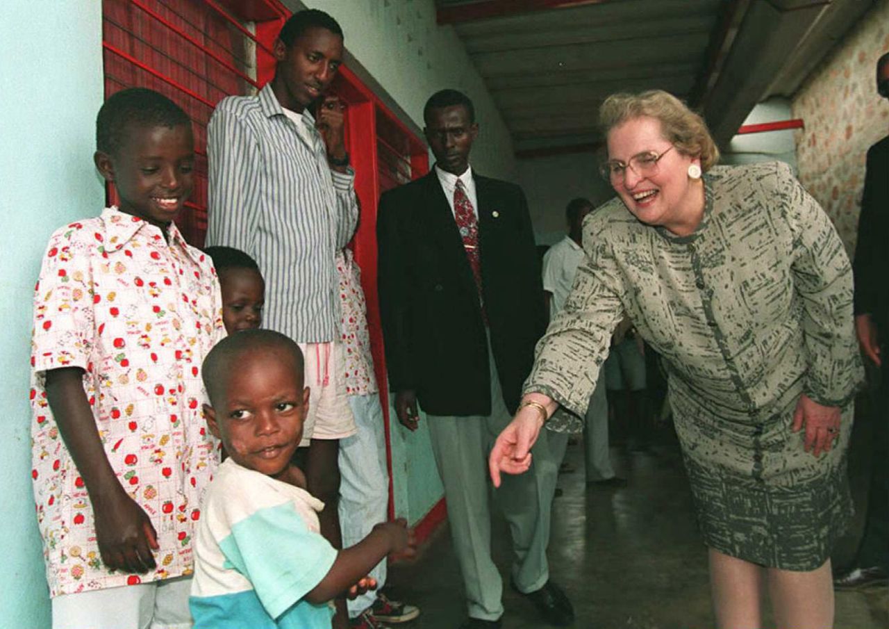 Albright reaches out to a Burundian orphan while visiting the country in 1996.