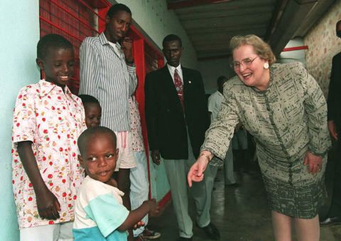 Albright reaches out to a Burundian orphan while visiting the country in 1996.