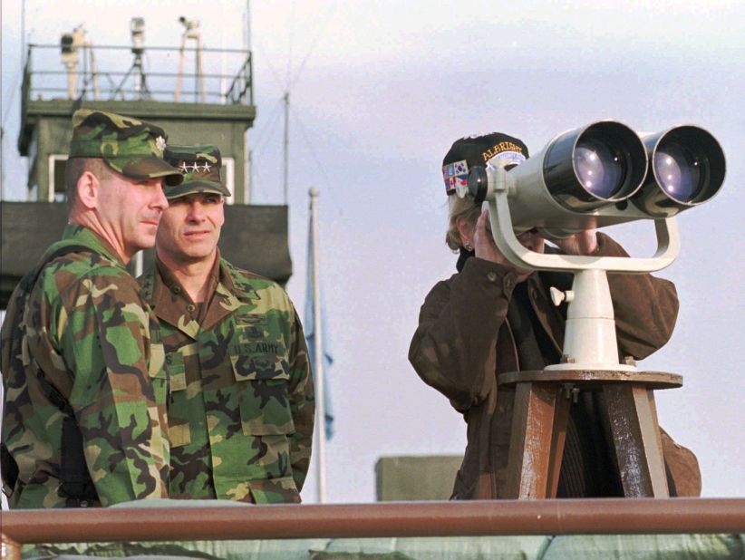 Albright looks over at North Korea during a visit to the border village of Panmunjom in 1997.