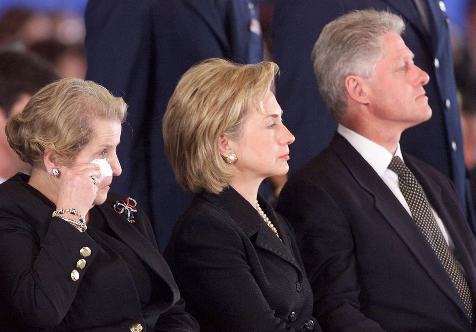 Albright wipes away a tear as she and the Clintons attend a memorial ceremony for US citizens who were killed in an embassy bombing in Kenya in 1998.