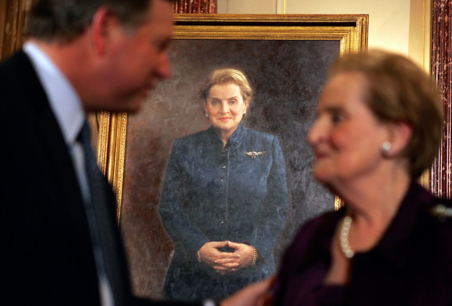 Albright speaks to a guest at the unveiling of her official portrait in Washington, DC, in 2008.