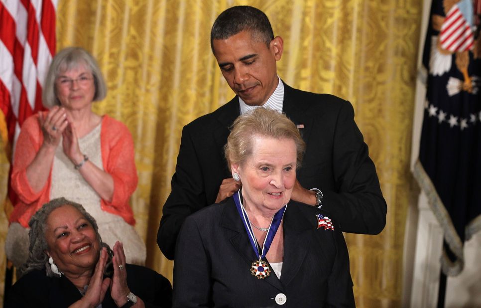 Obama presents Albright with the Presidential Medal of Freedom in 2012. "As the first woman to serve as America's top diplomat, Madeleine's courage and toughness helped bring peace to the Balkans and paved the way for progress in some of the most unstable corners of the world," Obama said in his remarks.