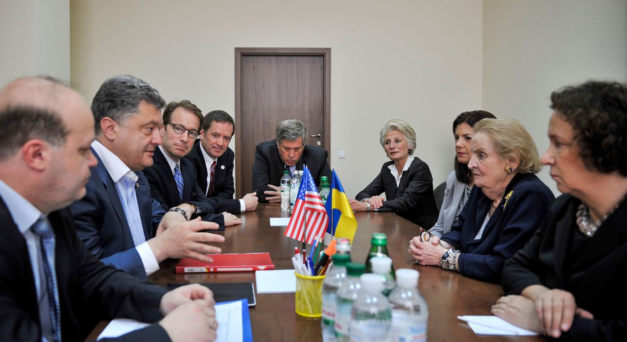 Albright talks with Ukrainian presidential candidate Petro Poroshenko at a meeting in Kyiv, Ukraine, in 2014.
