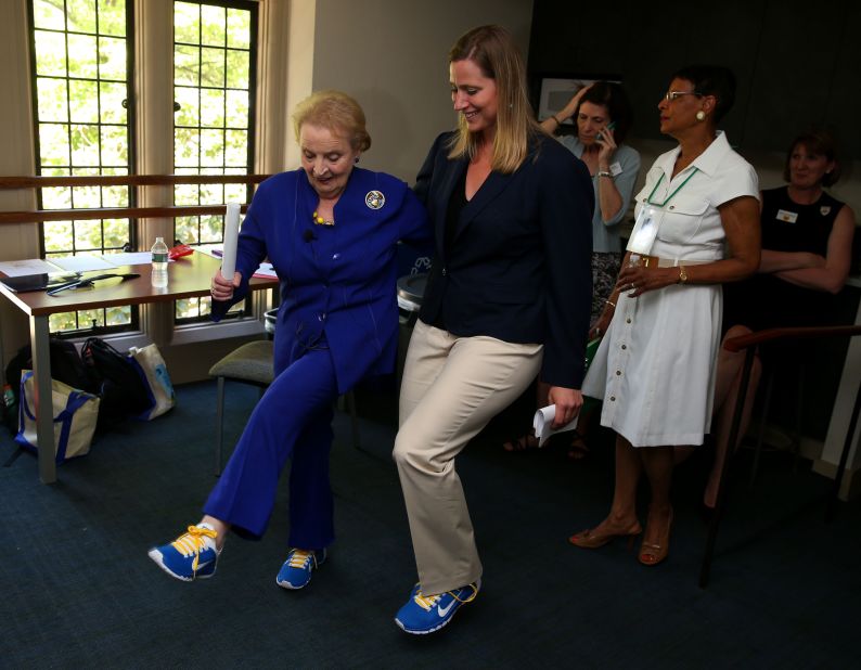 Albright shows off her sneakers with Olympic athlete Angela Ruggiero as they attended an alumni weekend at Wellesley College in 2014.