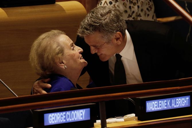 Actor George Clooney embraces Albright at the United Nations headquarters in 2016. They were attending a Leaders Summit for Refugees.
