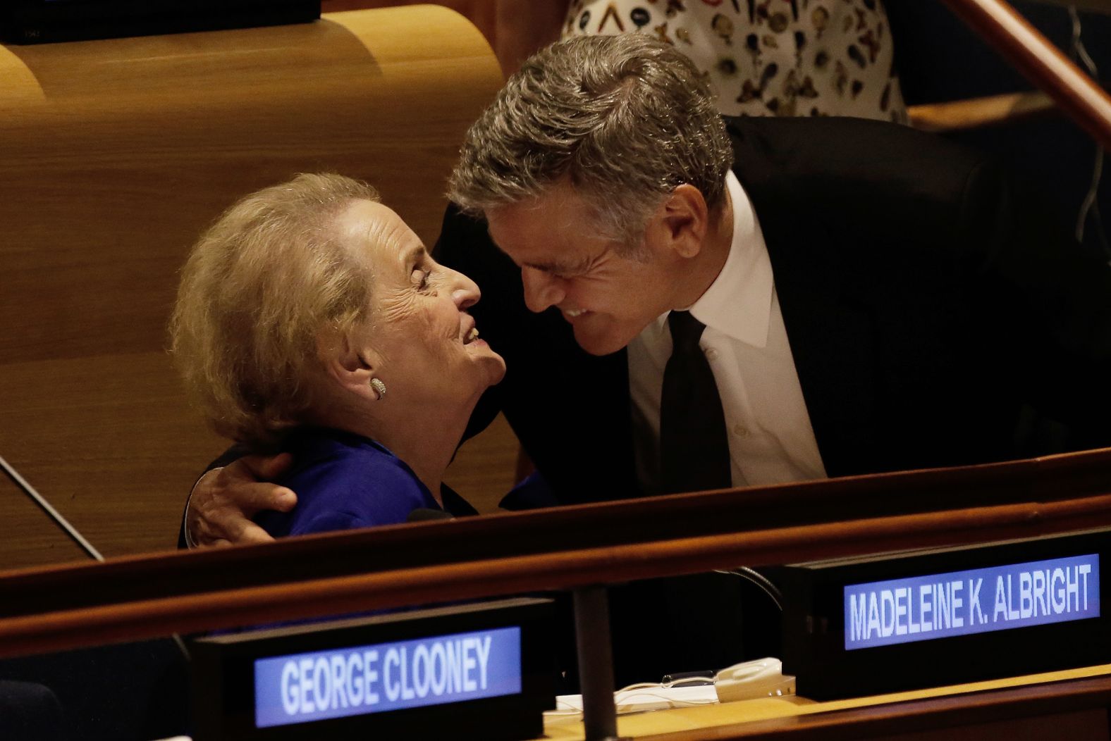 Actor George Clooney embraces Albright at the United Nations headquarters in 2016. They were attending a Leaders Summit for Refugees.