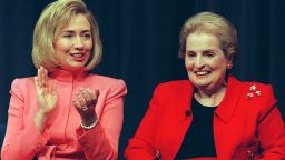 Then first lady of the US Hillary Rodham Clinton(L) applauds speakers as then Secretary of State Madeleine Albright(R) looks on during US State Department Activities to Promote the Advancement of Women program at the State Department in March 1997. T