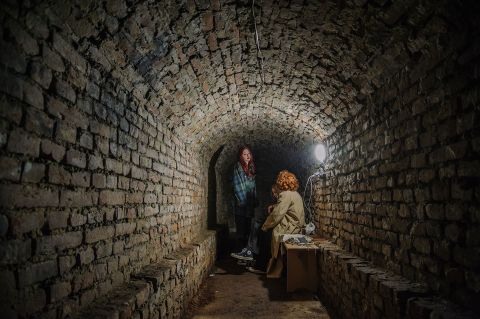 People hide in an underground shelter in Lviv on Tuesday, March 22.
