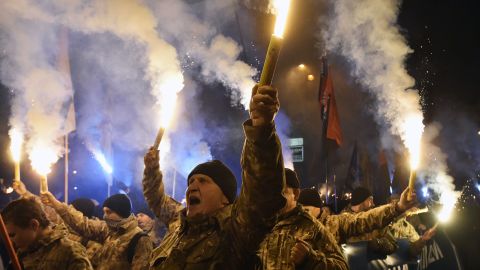 Members of the Azov regiment and veterans march with torches to celebrate Defender of Ukraine Day in Kyiv on October 14, 2016.