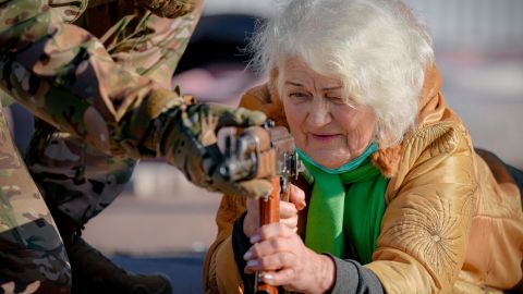 Valentyna Konstantynovska, aged 79, holds a weapon during basic combat training for civilians organized by the Azov regiment on February 13, 2022. 