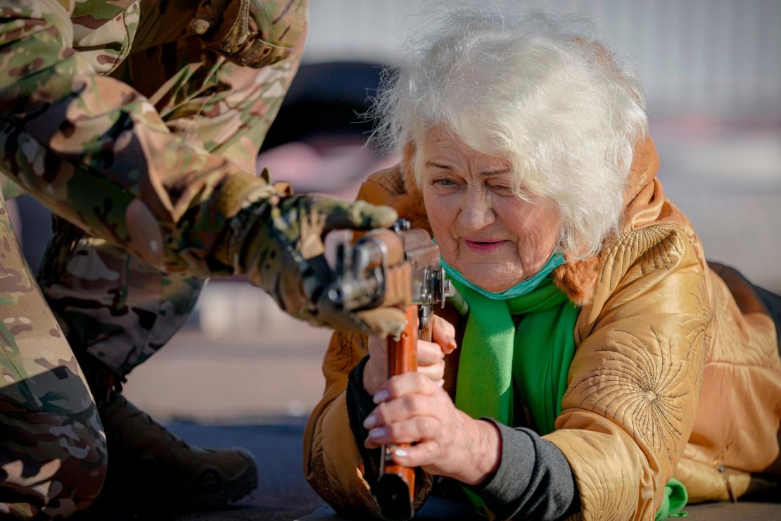 Valentyna Konstantynovska, aged 79, holds a weapon during basic combat training for civilians organized by the Azov regiment on February 13, 2022. 