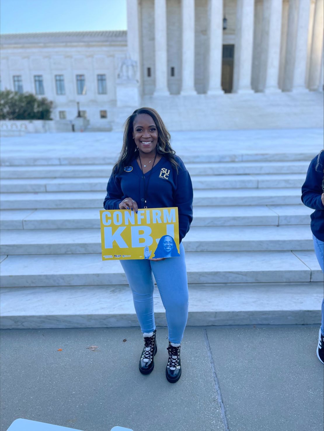 Ebony Cormier poses in front of Supreme Court, , in support of nominee Judge Jackson ahead of hearing on Monday, March 21, 2022. 