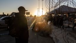 A migrant from Haiti near the San Ysidro Port of Entry border crossing bridge in Tijuana, Mexico, on Tuesday, March 22, 2022.