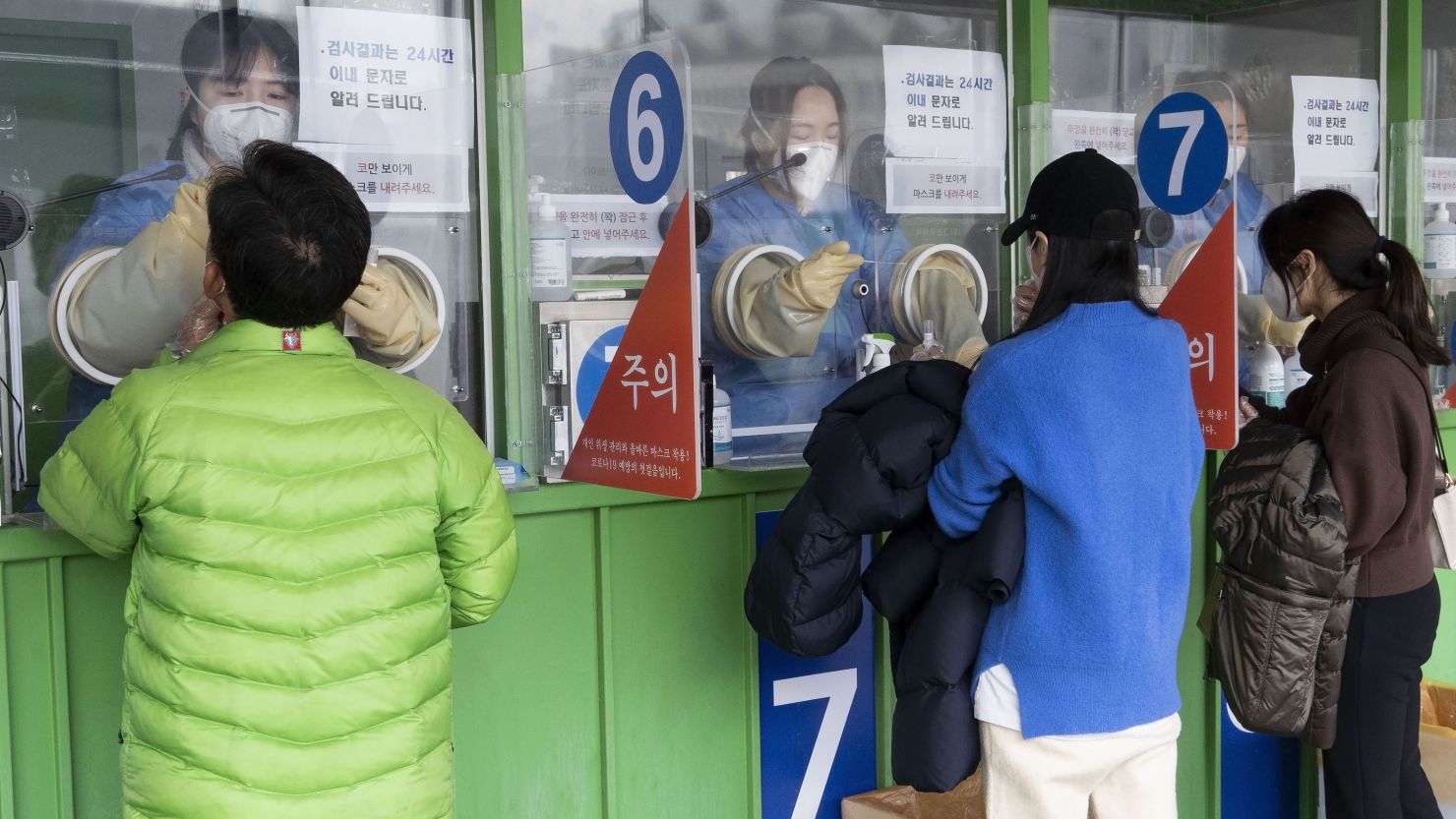 People wait to receive Covid-19 tests in Seoul, South Korea, on March 20.