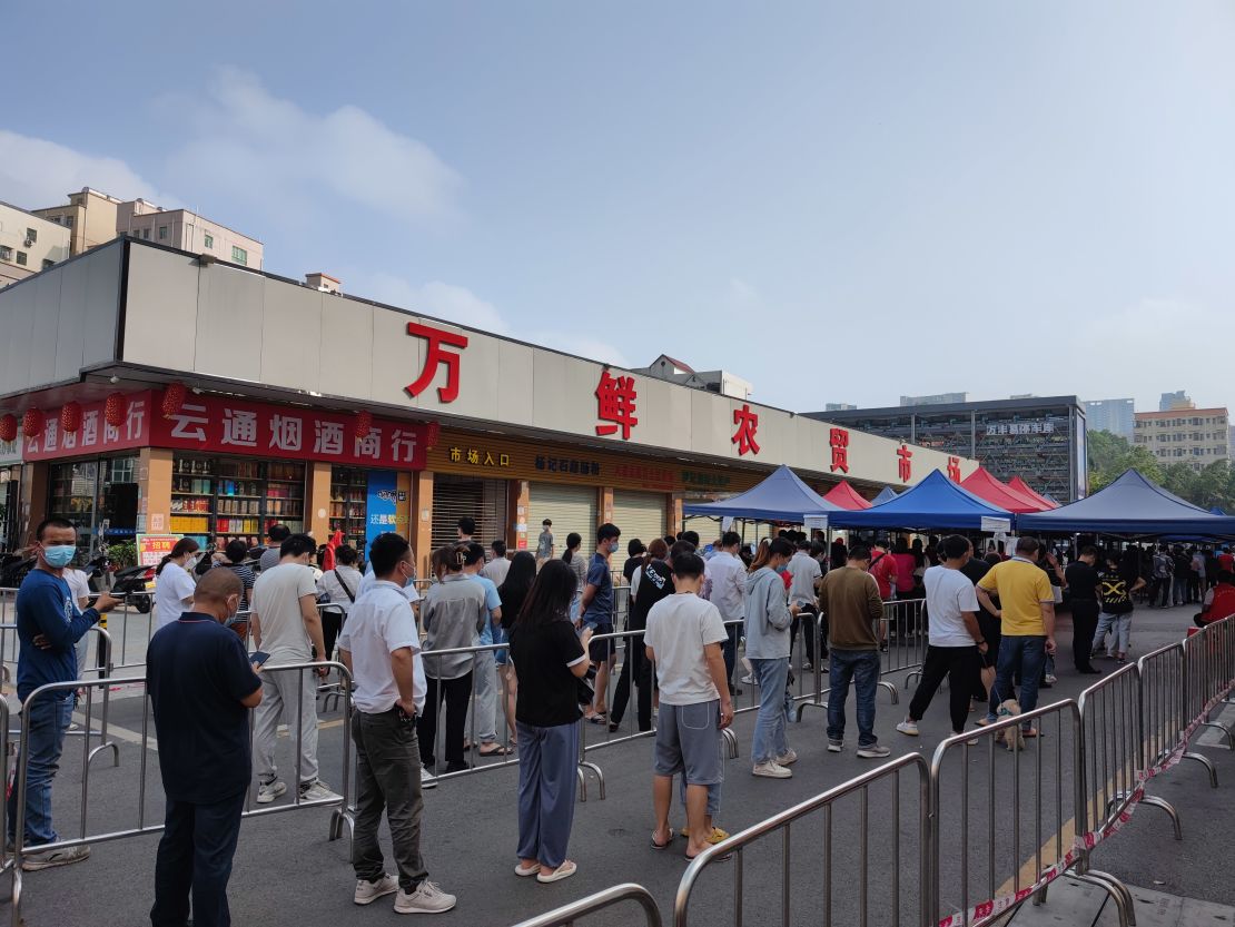  People line up for nucleic acid testing at a temporary Covid-19 testing site on March 22, 2022 in Shenzhen.