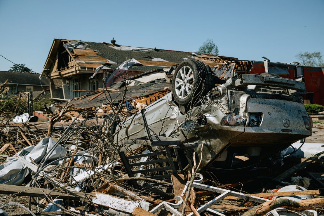 An overturned vehicle is seen Wednesday amid destroyed homes in Arabi, Louisiana.